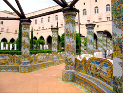 Naples and Pompeii tour - Nuns' cloister of Santa Chiara Basilica, with parapets and coloumns covered with decorative ceramic tiles